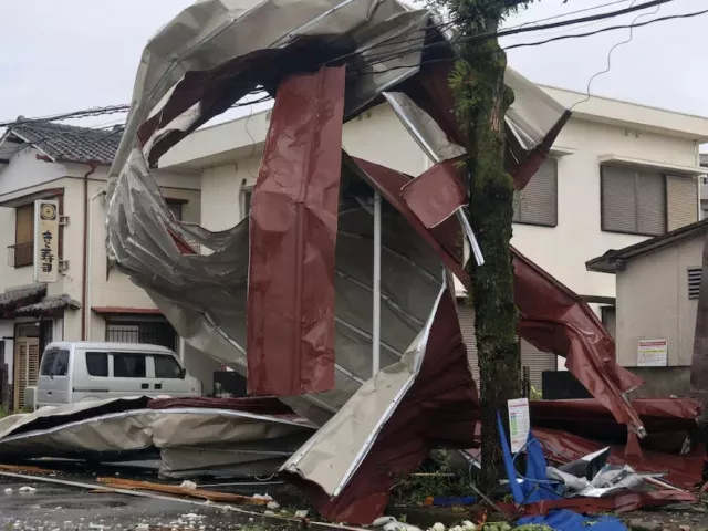 an object blown by strong winds caused by typhoon shanshan is stranded on a power line in miyazaki southwestern japan august 29 2024 photo reuters
